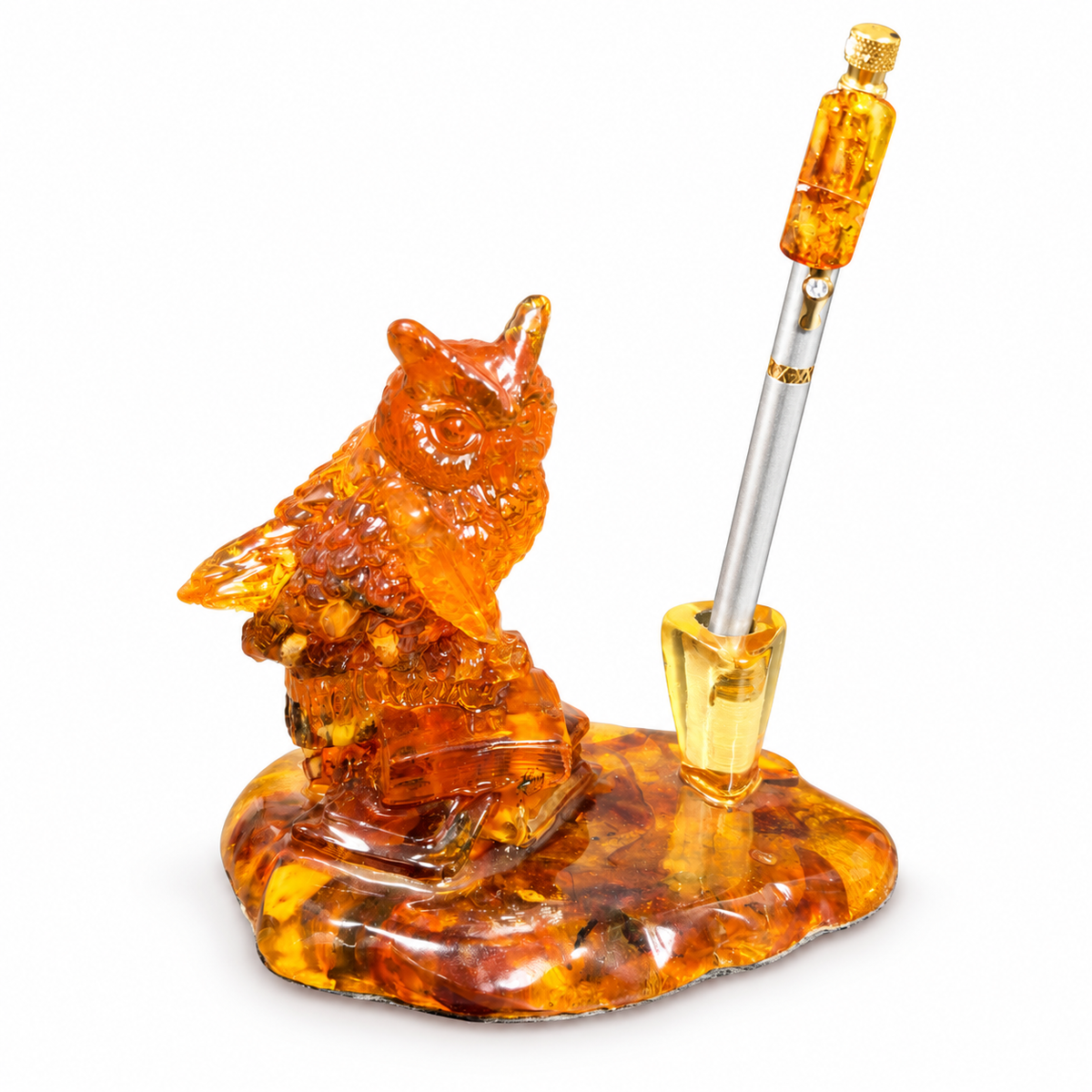 Translucent orange owl pen holder and single pen socket on white