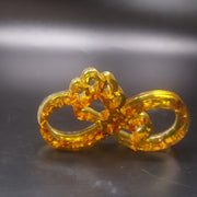 Made in USA KIZIMA natural Baltic amber infinity paw sculpture symbolizing dog and cat love