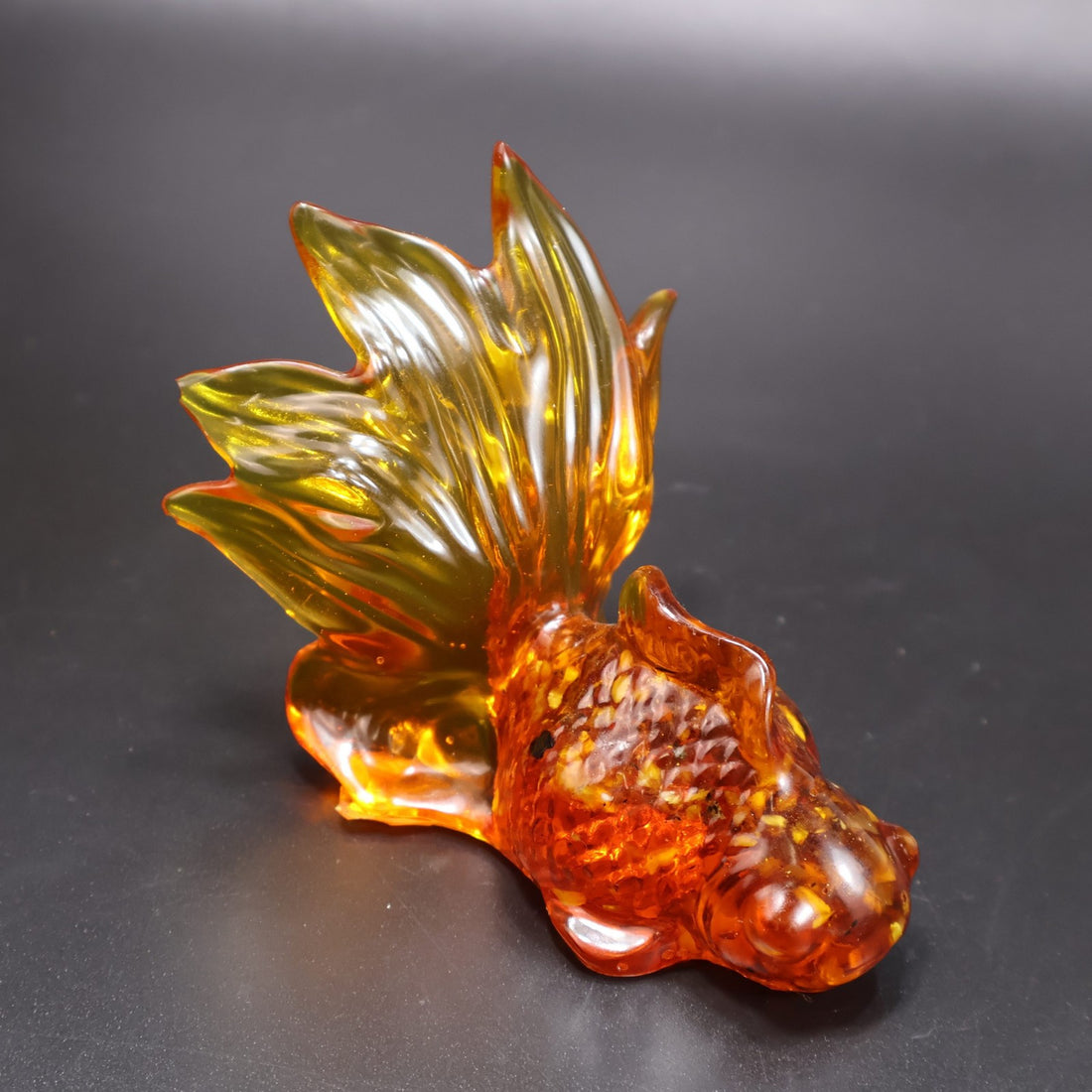 Handmade Baltic amber goldfish by KIZIMA® USA — natural amber decor, angled view