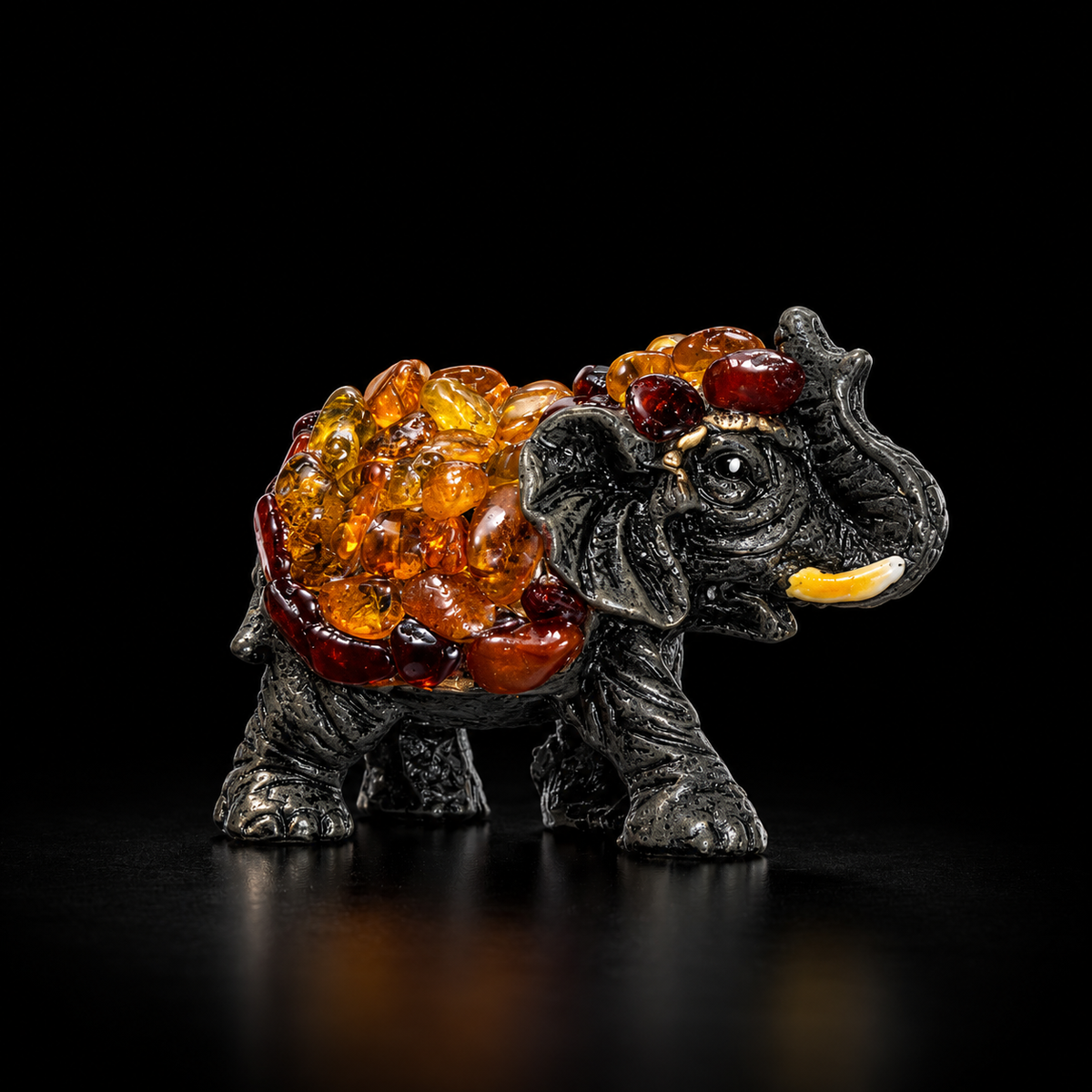 Made in USA Natural Baltic Amber success elephant figurine size S, trunk up, amber mosaic back, black studio background — KIZIMA®