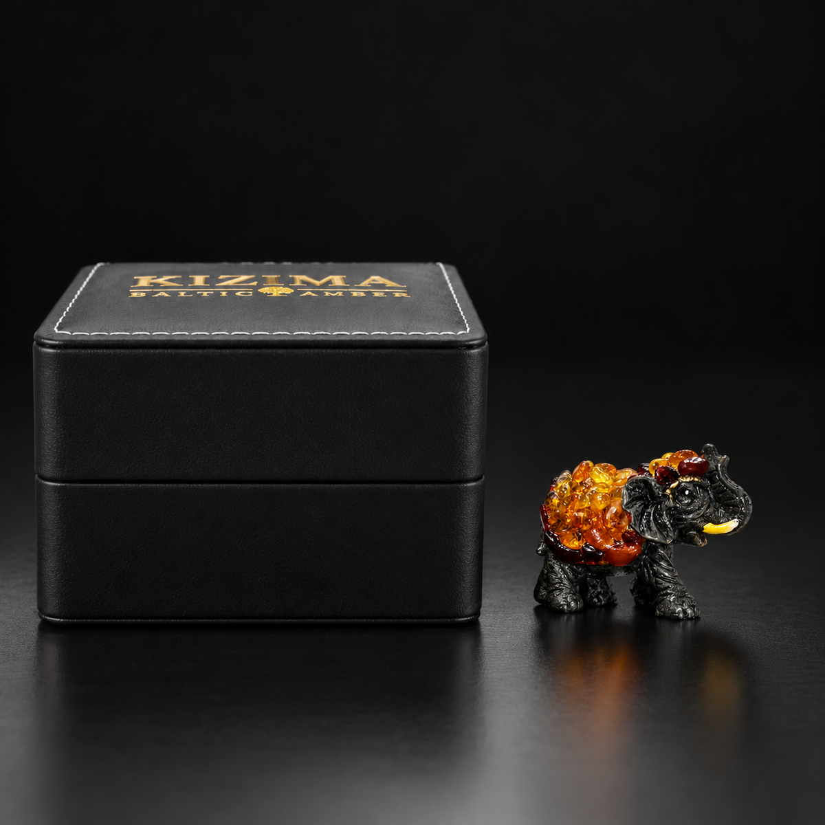 Baltic amber success elephant figurine S with KIZIMA® black gift box — ready-to-give elephant gift