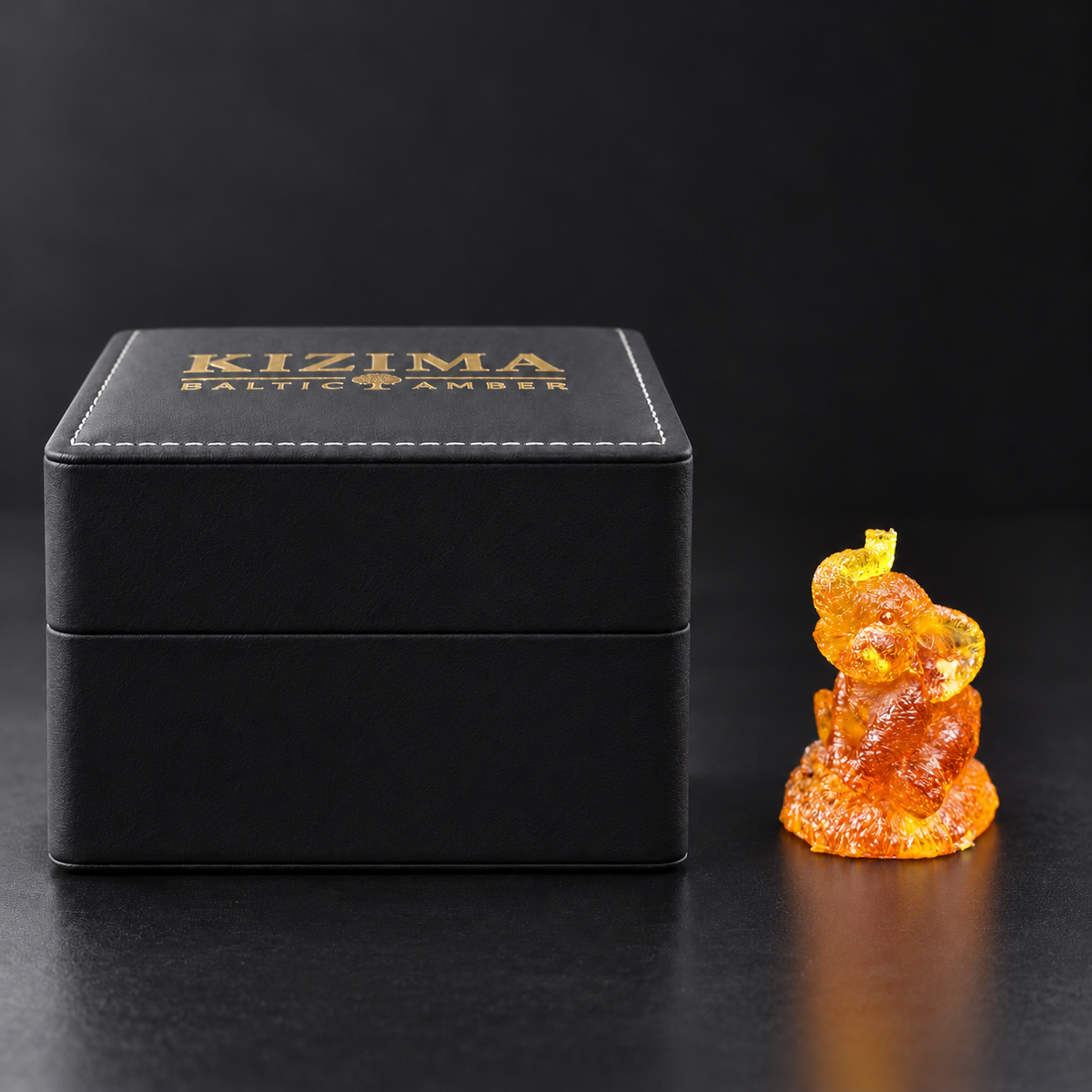 Baltic amber seated elephant figurine with KIZIMA® black gift box — good luck elephant gift