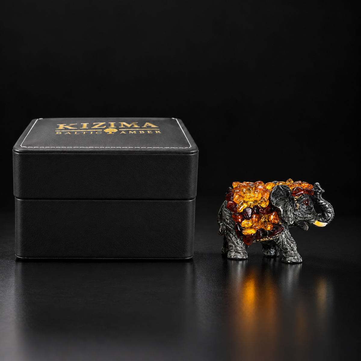 Baltic amber success elephant figurine M with KIZIMA® black gift box — elephant gift for new job or housewarming