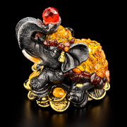 Made in USA Natural Baltic Amber Money Elephant figurine on coins with red crystal in raised trunk, black studio background — KIZIMA®