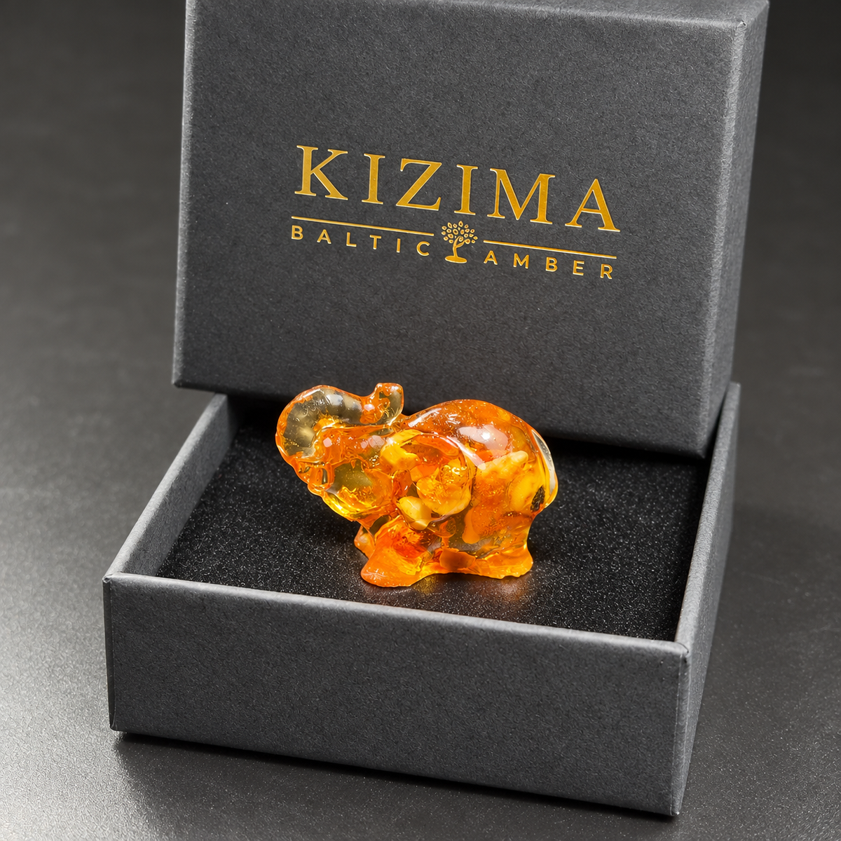 Baltic amber mini elephant figurine with KIZIMA® black gift box — ready-to-give stocking stuffer