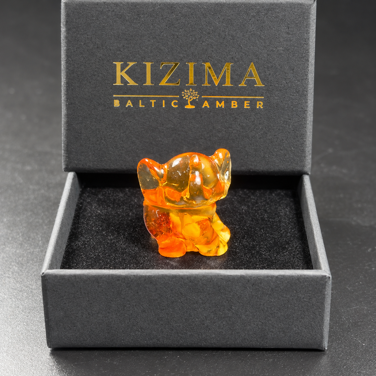 Baltic amber baby elephant figurine with KIZIMA® black gift box — ready-to-give elephant gift