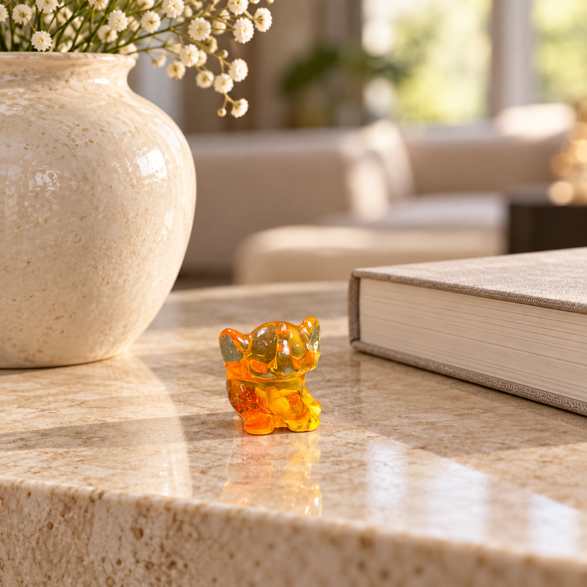 Baltic amber baby elephant figurine on a shelf in a New York interior — handmade in Brooklyn by KIZIMA®