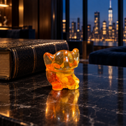 KIZIMA Baltic amber baby elephant figurine, 4 cm, styled in a dark Manhattan luxury interior