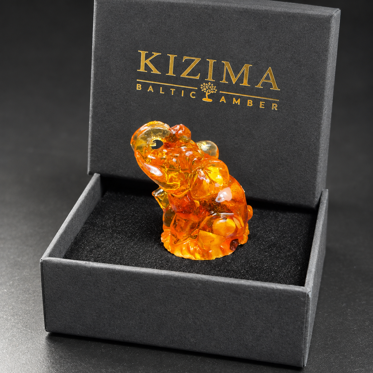 Baltic amber seated elephant figurine with KIZIMA® black gift box — ready-to-give good luck gift