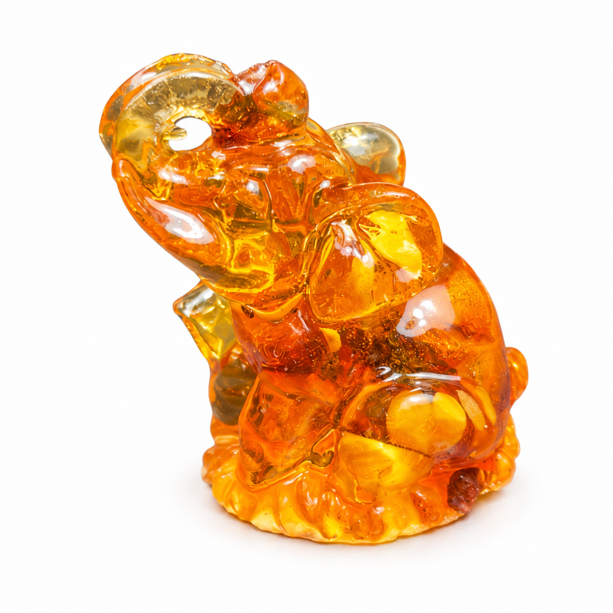 Natural Baltic Amber seated elephant figurine by KIZIMA®, white background — feng shui luck charm gift