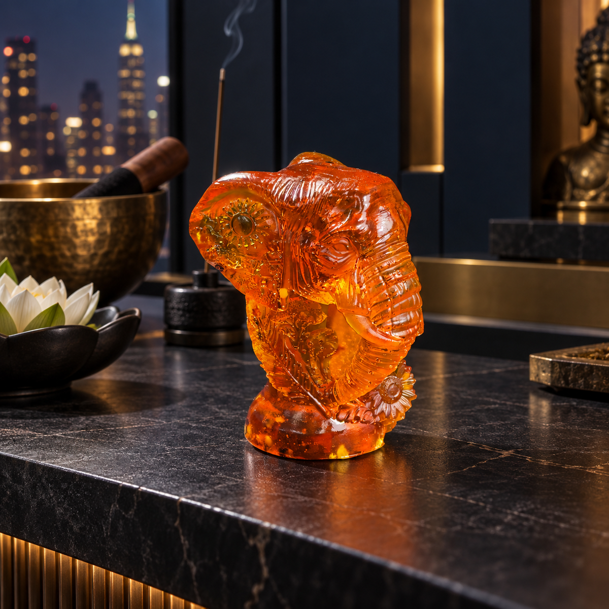 KIZIMA Baltic amber Ganesha head statue, 10 cm, in a dark luxury meditation interior