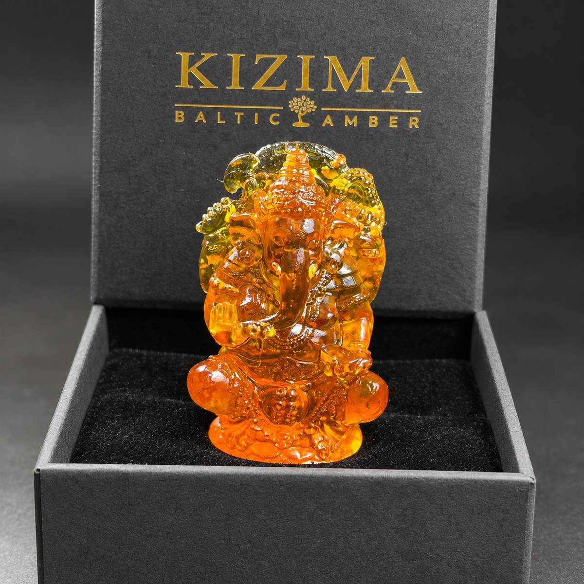 Baltic amber Ganesha statue with KIZIMA® black gift box — ready-to-give spiritual gift