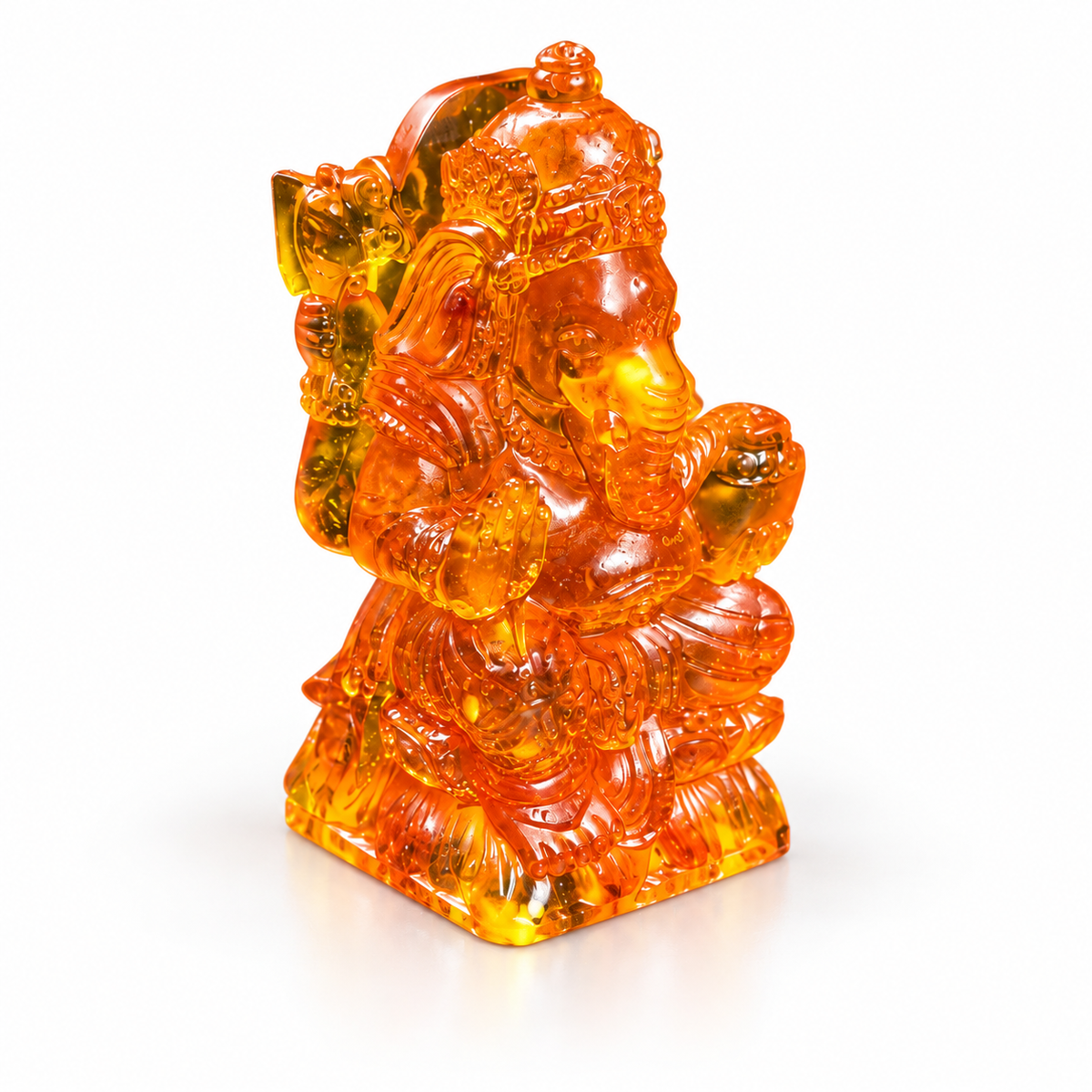 Natural Baltic Amber small Ganesha statue by KIZIMA®, white background — pocket altar idol gift