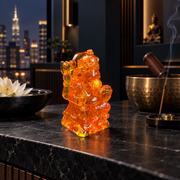 KIZIMA Baltic amber small Ganesha statue, 7 cm, in a dark luxury meditation interior