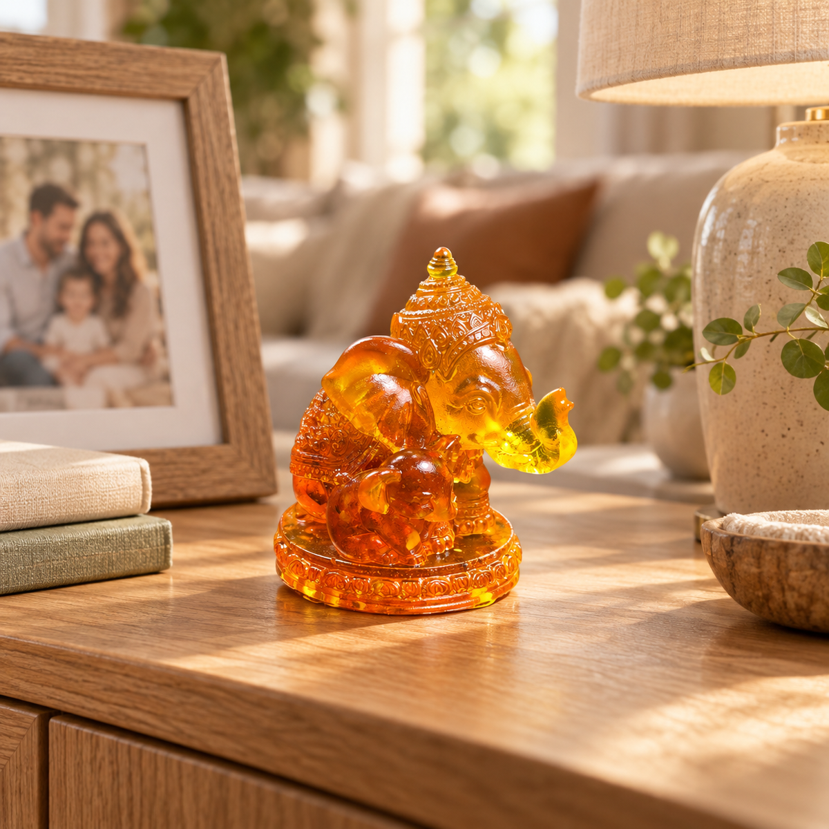 Baltic amber mother and baby elephant figurine in a warm family home interior — handmade in Brooklyn by KIZIMA®