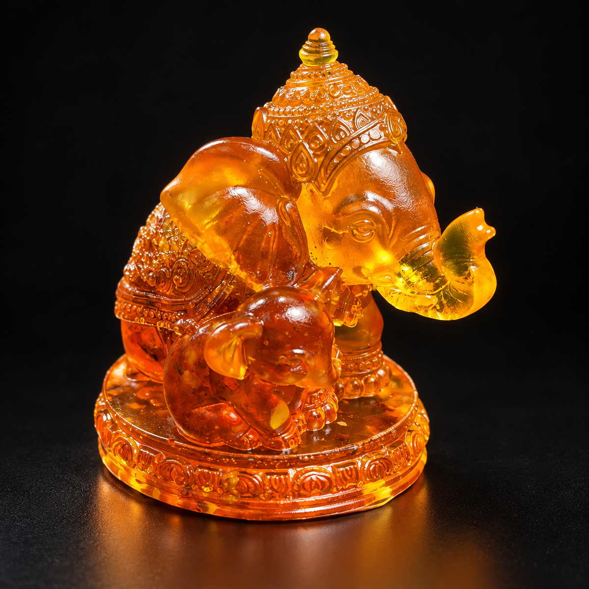 Made in USA Natural Baltic Amber elephant family figurine, mother elephant with baby on carved base, honey-cognac amber, black studio background — KIZIMA®