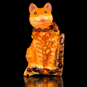 Made in USA Natural Baltic Amber cat fridge magnet by KIZIMA®, orange striped cat with real amber pieces, black studio background