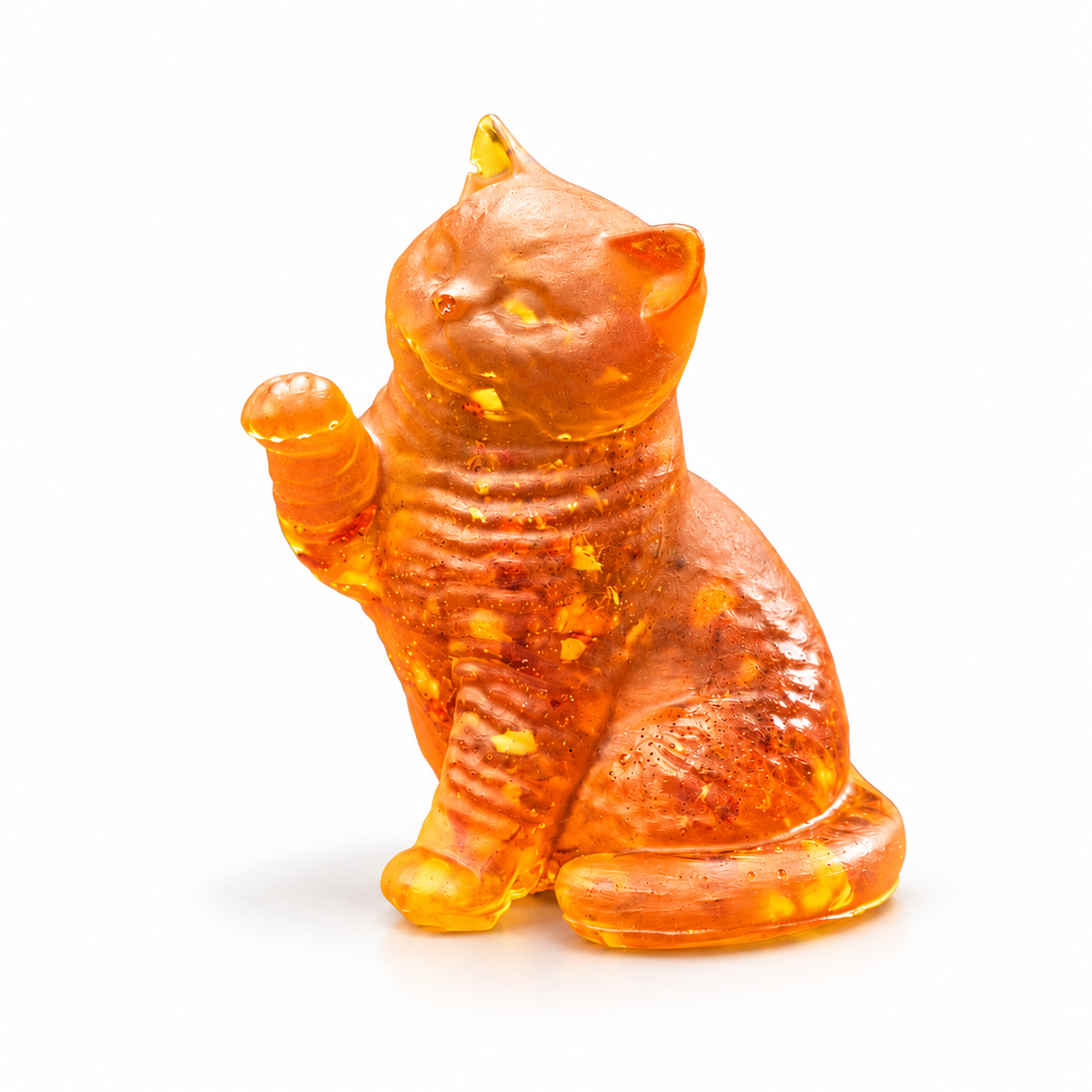 Made in USA Natural Baltic Amber raised-paw cat figurine by KIZIMA®, three-quarter view with textured chest and wrapped tail on white