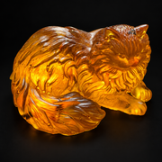 Made in USA Natural Baltic Amber Persian cat figurine by KIZIMA®, 9 cm golden reclining long-haired cat with curled plume tail, black studio background