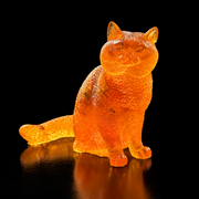 Made in USA Natural Baltic Amber sitting cat figurine by KIZIMA®, 7 cm fluffy golden-orange cat with long tail, black studio background