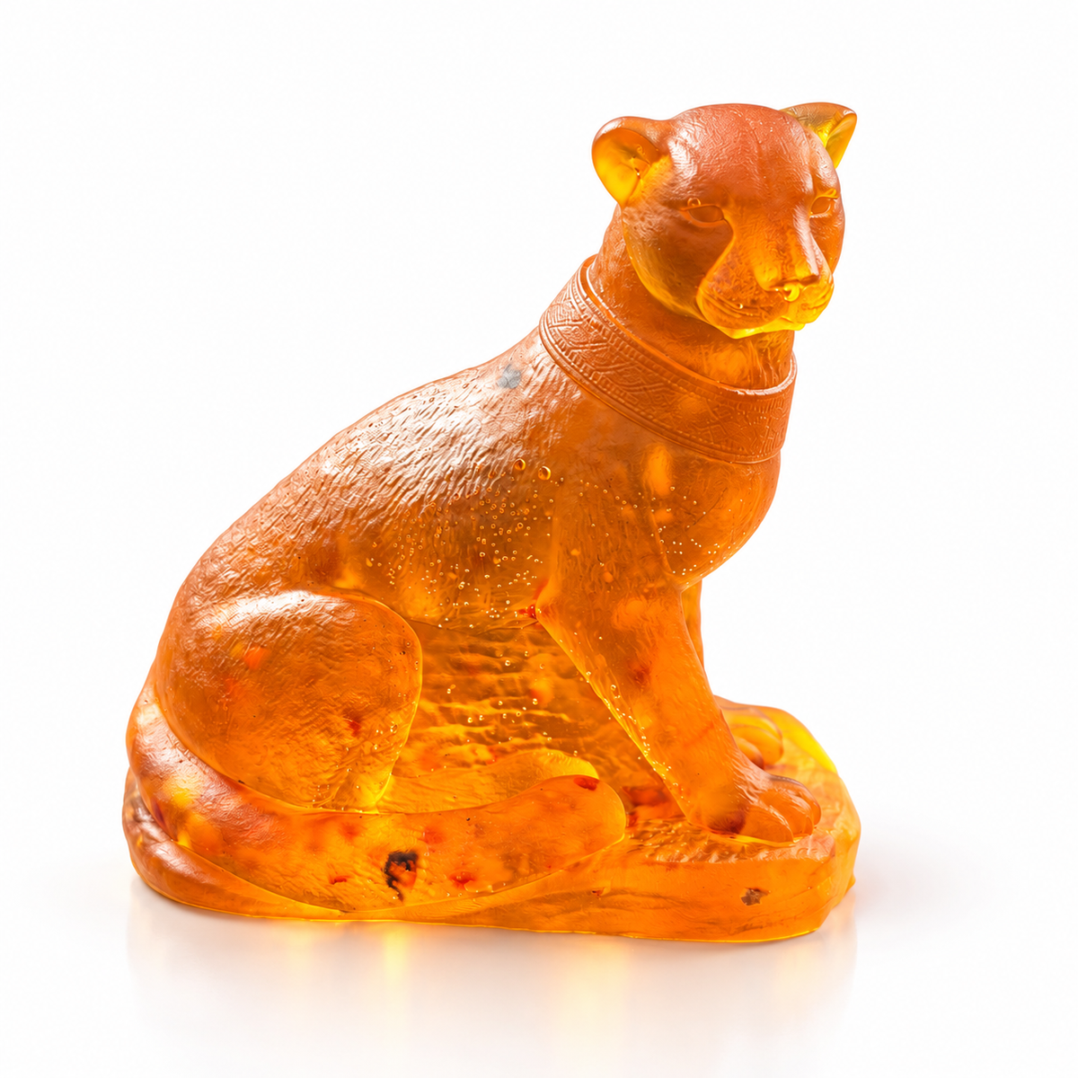 Made in USA Natural Baltic Amber panther figurine by KIZIMA®, side view of the golden-orange seated big cat with textured fur and low base on white