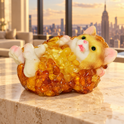 Baltic amber playful cat figurine in a New York apartment interior — cat home decor by KIZIMA®