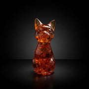 Handmade honey Baltic amber cat sculpture by KIZIMA® USA — natural amber gift, side view