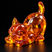 KIZIMA amber cat figurine on a black studio background