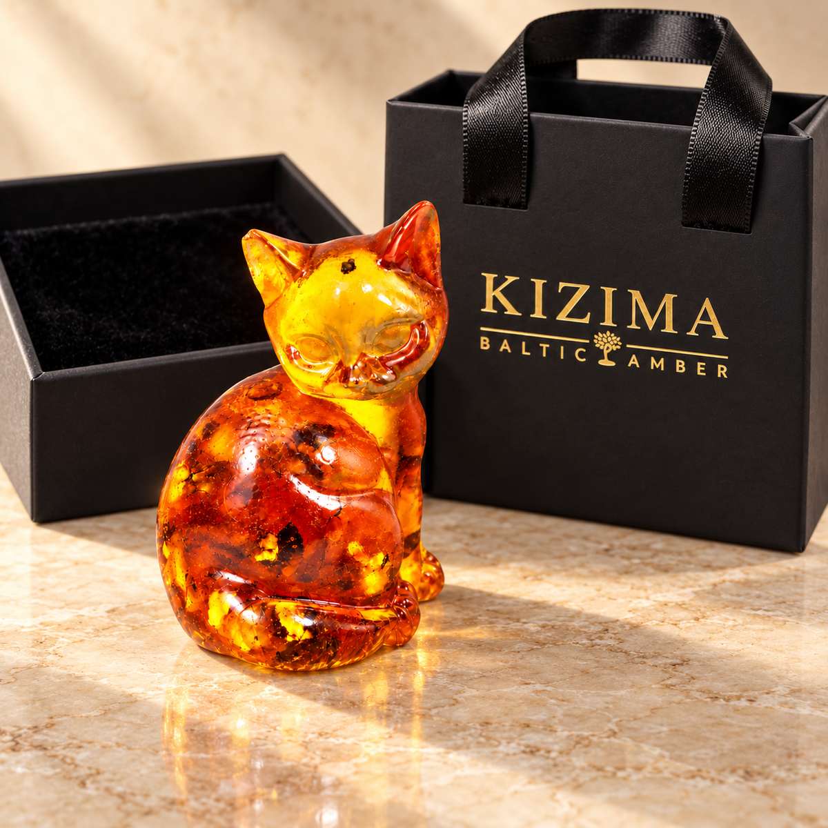 KIZIMA rounded amber sitting cat with branded gift packaging