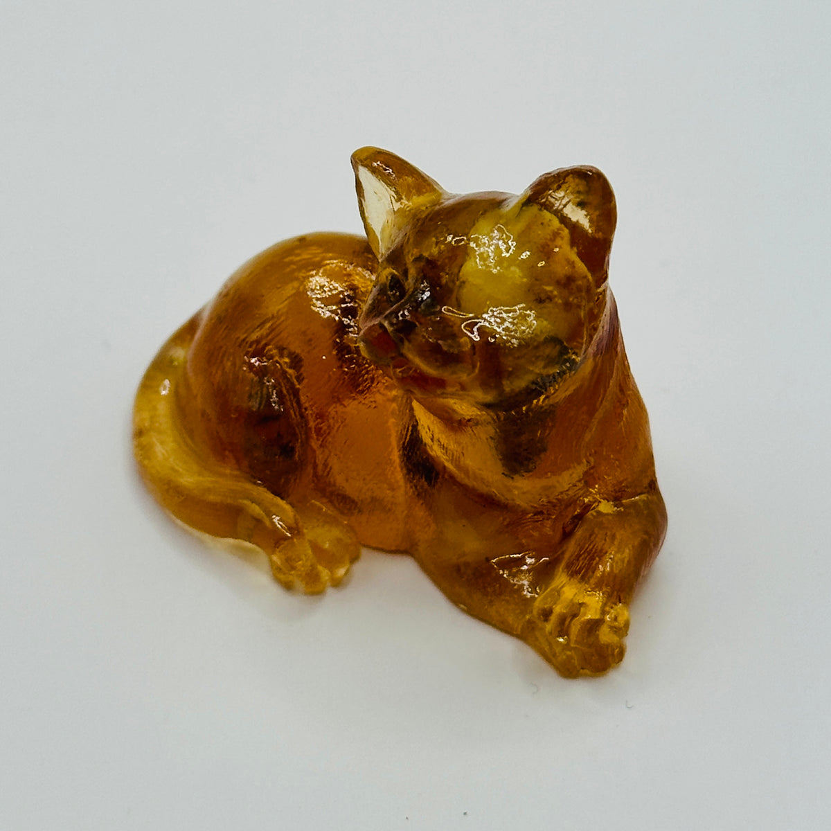 Original photograph of Baltic amber reclining cat figurine 12K004q