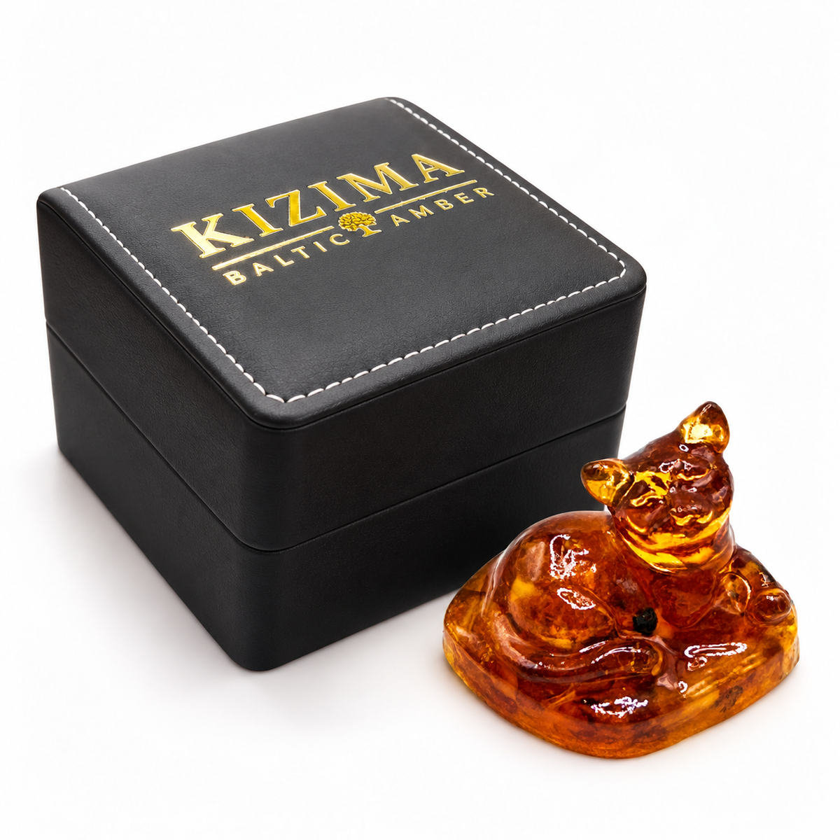 KIZIMA cat figurine beside the actual black stitched branded gift box