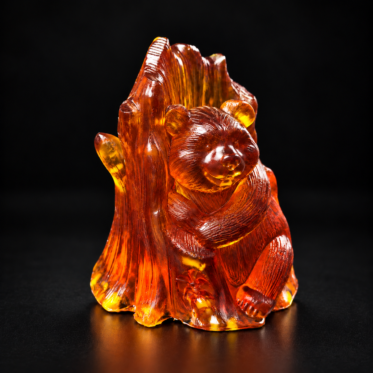 Cognac Baltic amber bear embracing a textured tree trunk on a black studio background with warm golden highlights.