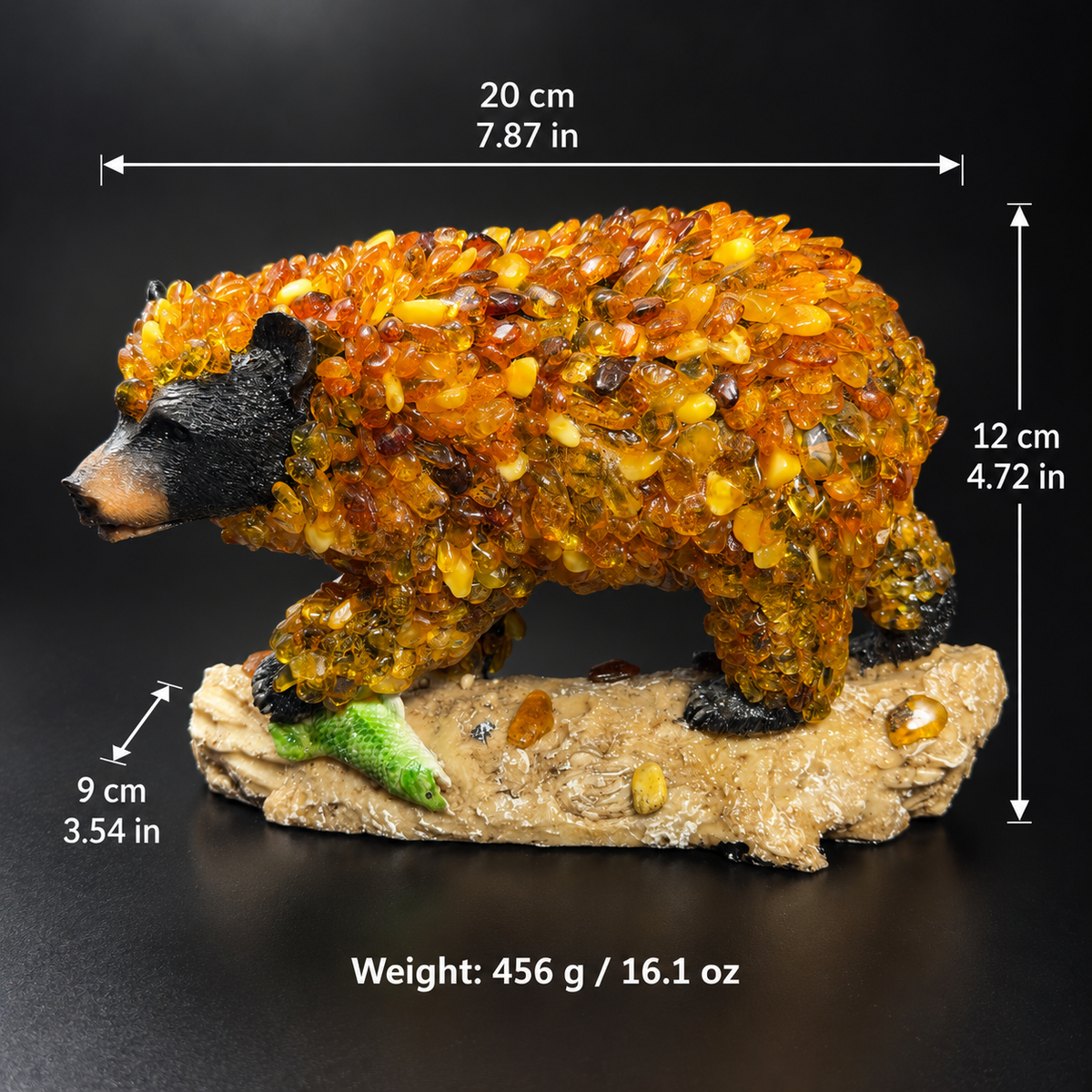 Baltic amber bear sculpture dimensions 20 by 9 by 12 cm and weight 456 g on black studio background