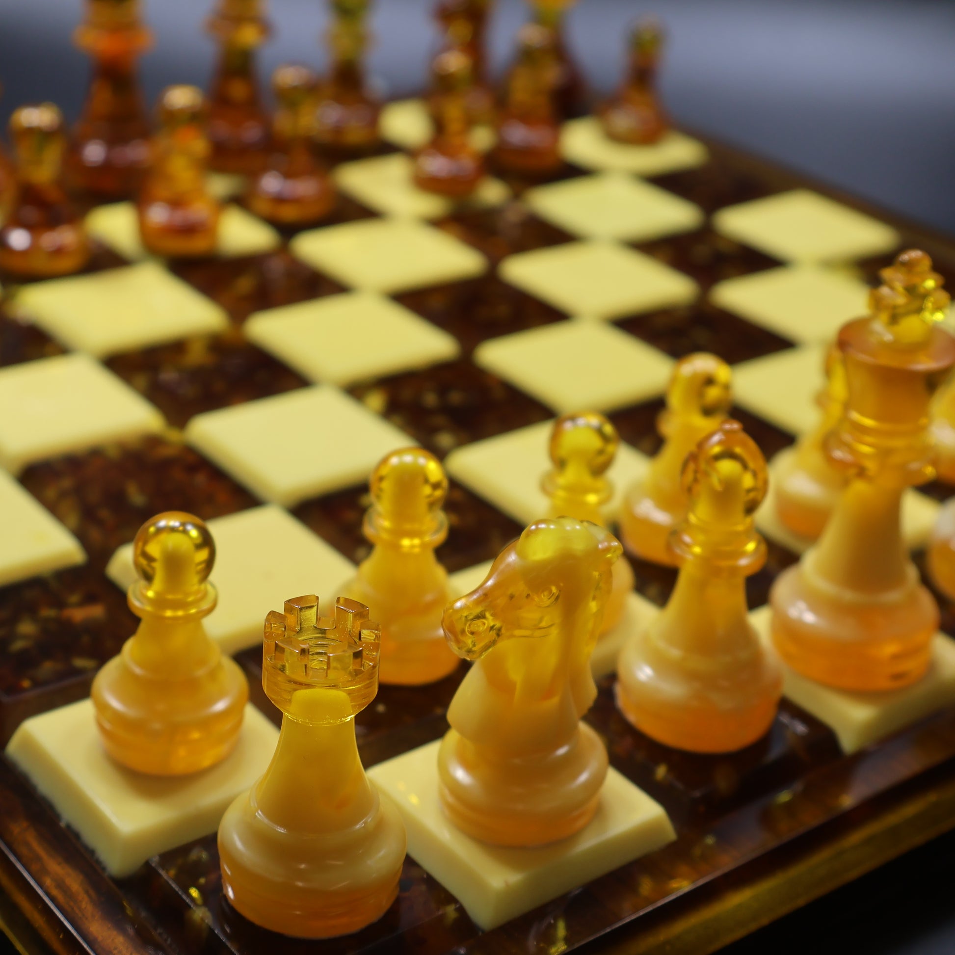 Natural Baltic amber chess pieces on rattan-inlaid wood board, luxury handmade chess set made in USA by KIZIMA