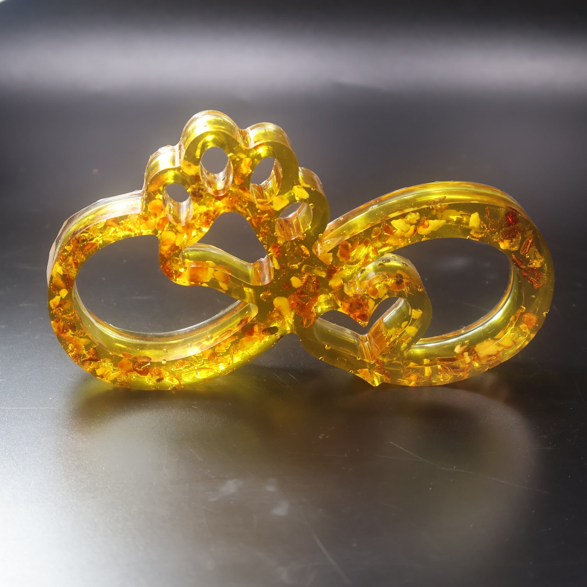 Made in USA KIZIMA natural Baltic amber infinity paw sculpture symbolizing dog and cat love