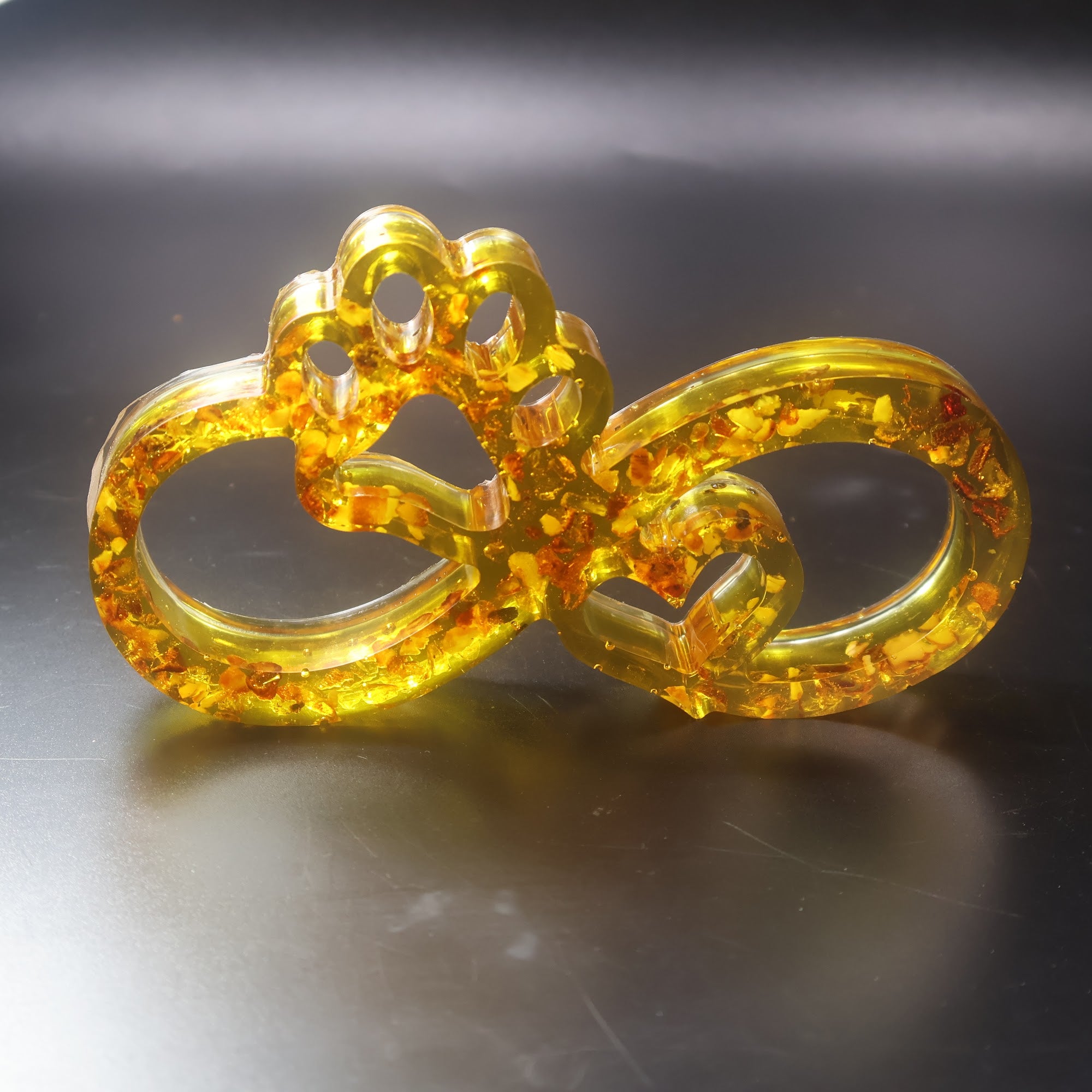 Made in USA KIZIMA natural Baltic amber infinity paw sculpture symbolizing dog and cat love