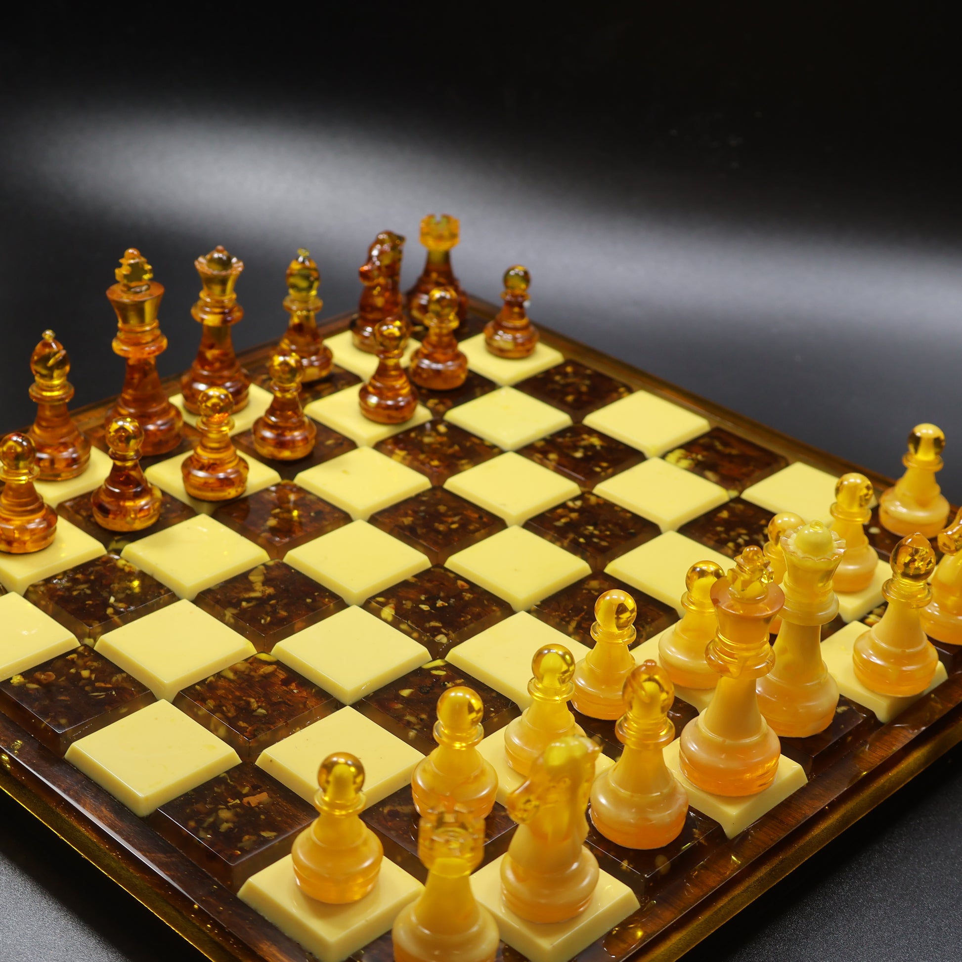 Amber chess set detail on rattan inlaid wooden board, natural Baltic amber king and queen pieces, KIZIMA handmade USA