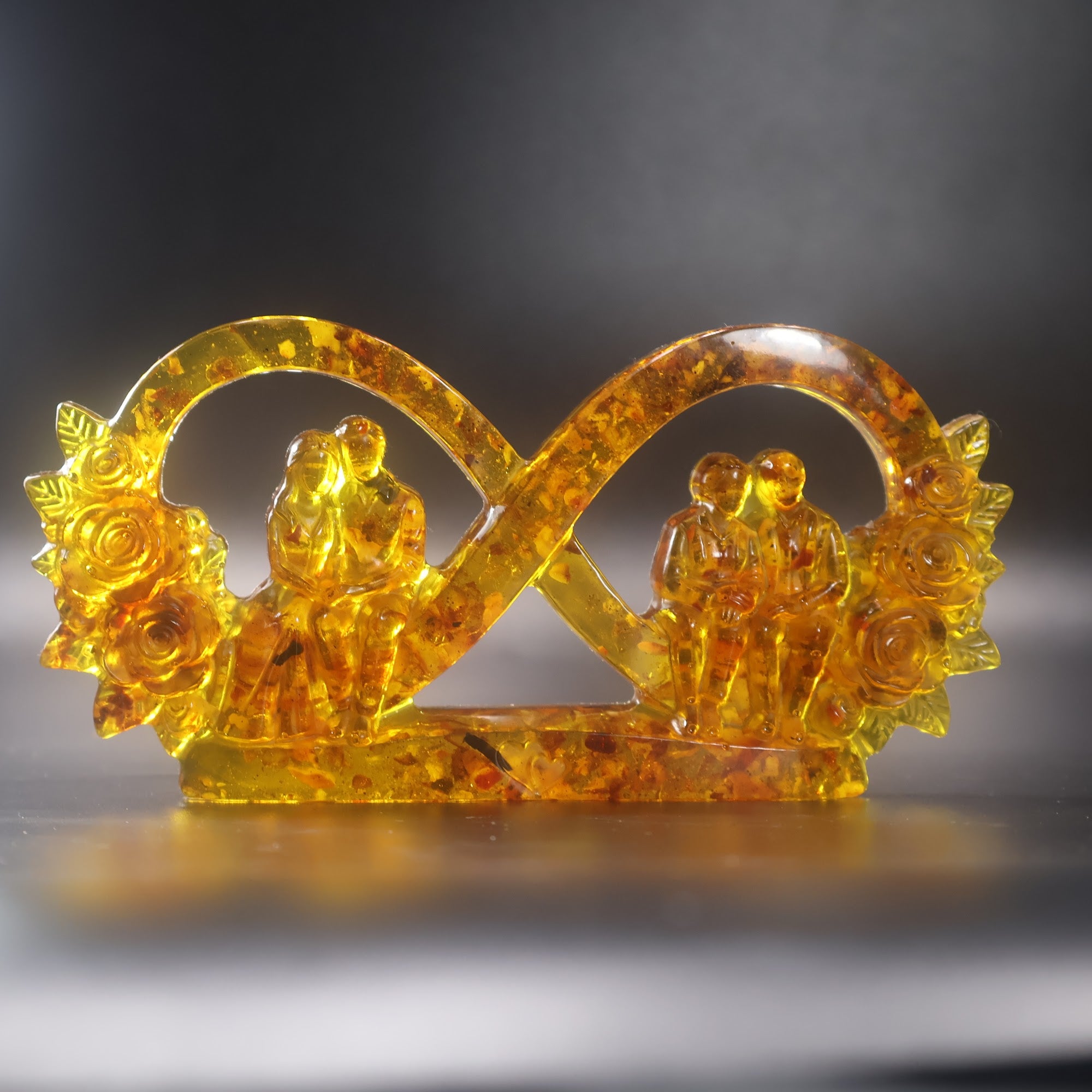 Made in USA KIZIMA natural Baltic amber infinity love sculpture with young wedding couple and grandparents