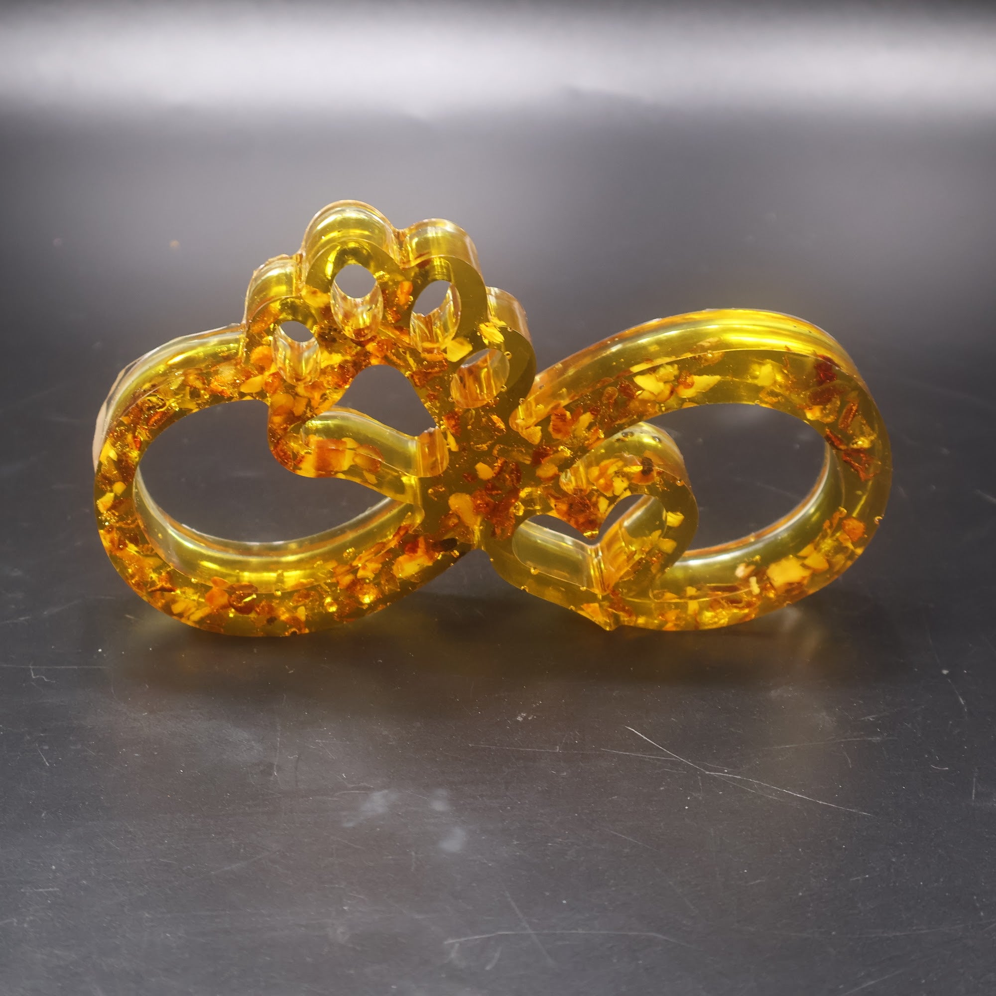 Made in USA KIZIMA natural Baltic amber infinity paw sculpture symbolizing dog and cat love