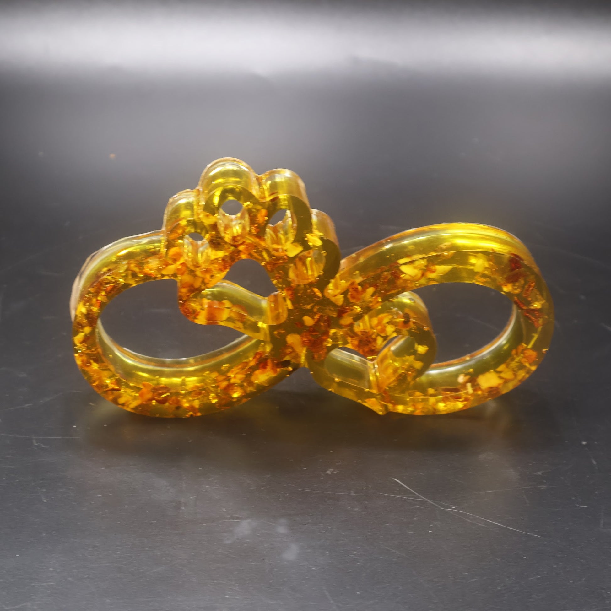 Made in USA KIZIMA natural Baltic amber infinity paw sculpture symbolizing dog and cat love