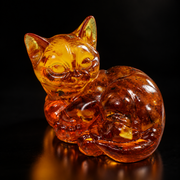 Made in USA Natural Baltic Amber Curled Cat Figurine by KIZIMA® — handmade amber cat sculpture, front view