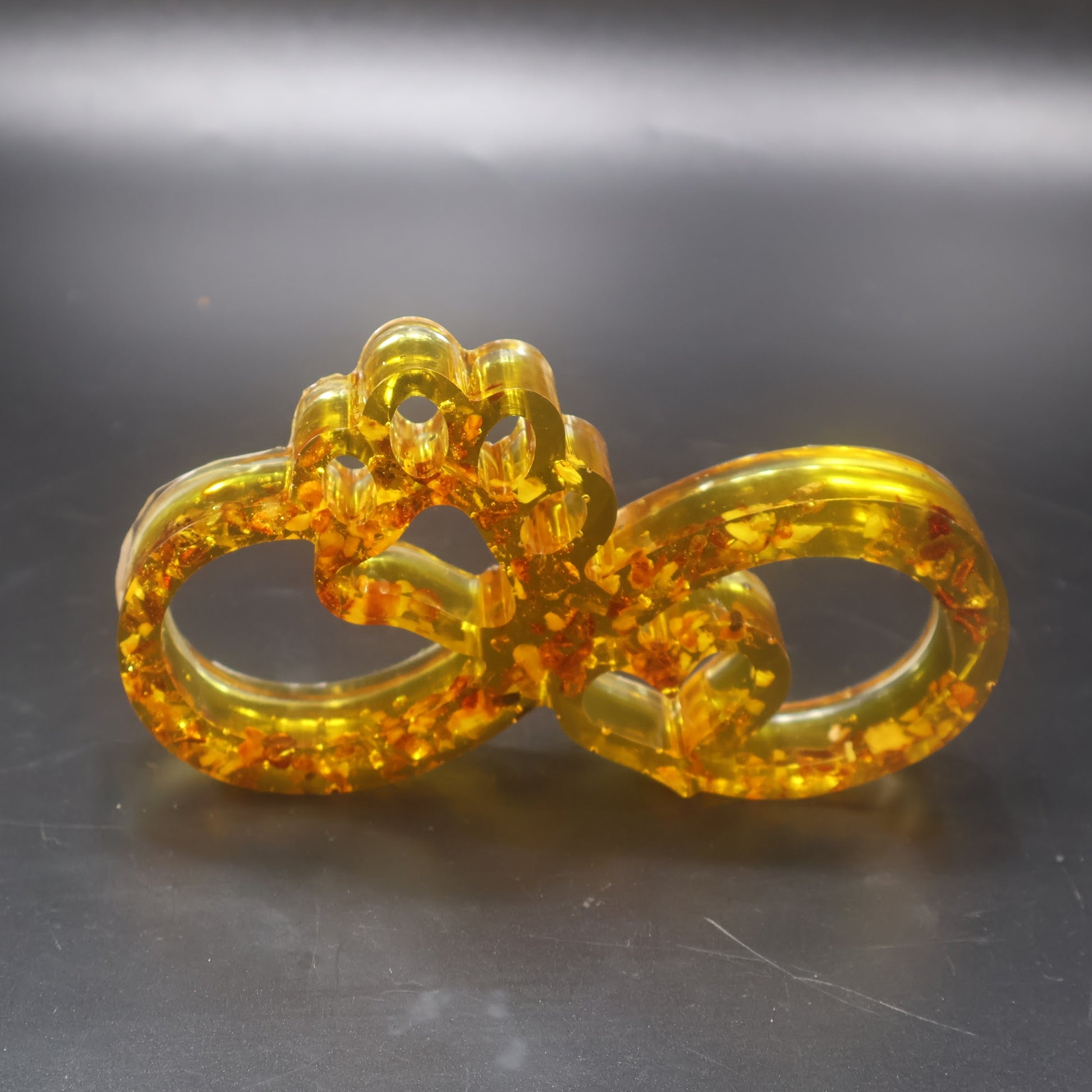 Made in USA KIZIMA natural Baltic amber infinity paw sculpture symbolizing dog and cat love