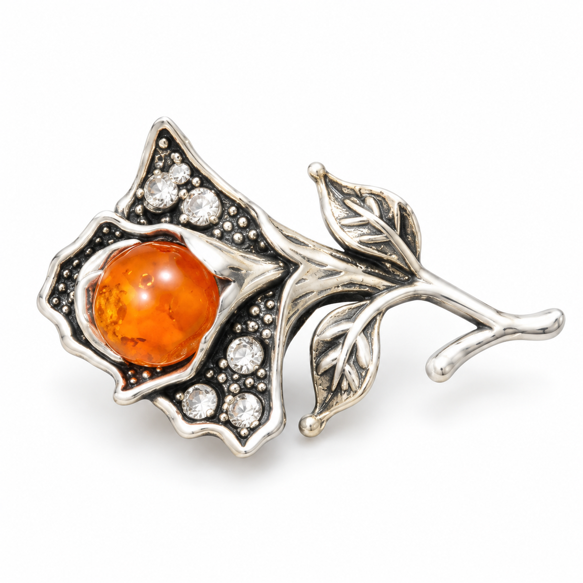 KIZIMA silver-tone flower brooch 20N0120q3.9 with orange amber and clear crystals on a white background.