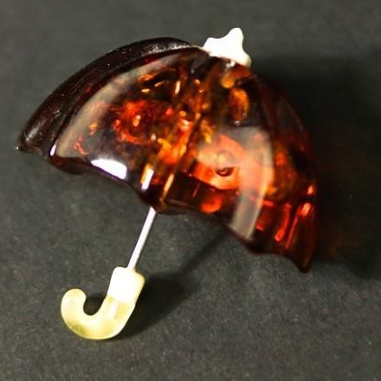 Baltic amber umbrella brooch — genuine Baltic amber, handcrafted in USA by KIZIMA®, front view