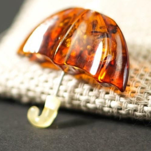 Handmade Baltic amber umbrella brooch by KIZIMA® — natural amber jewelry, made in USA