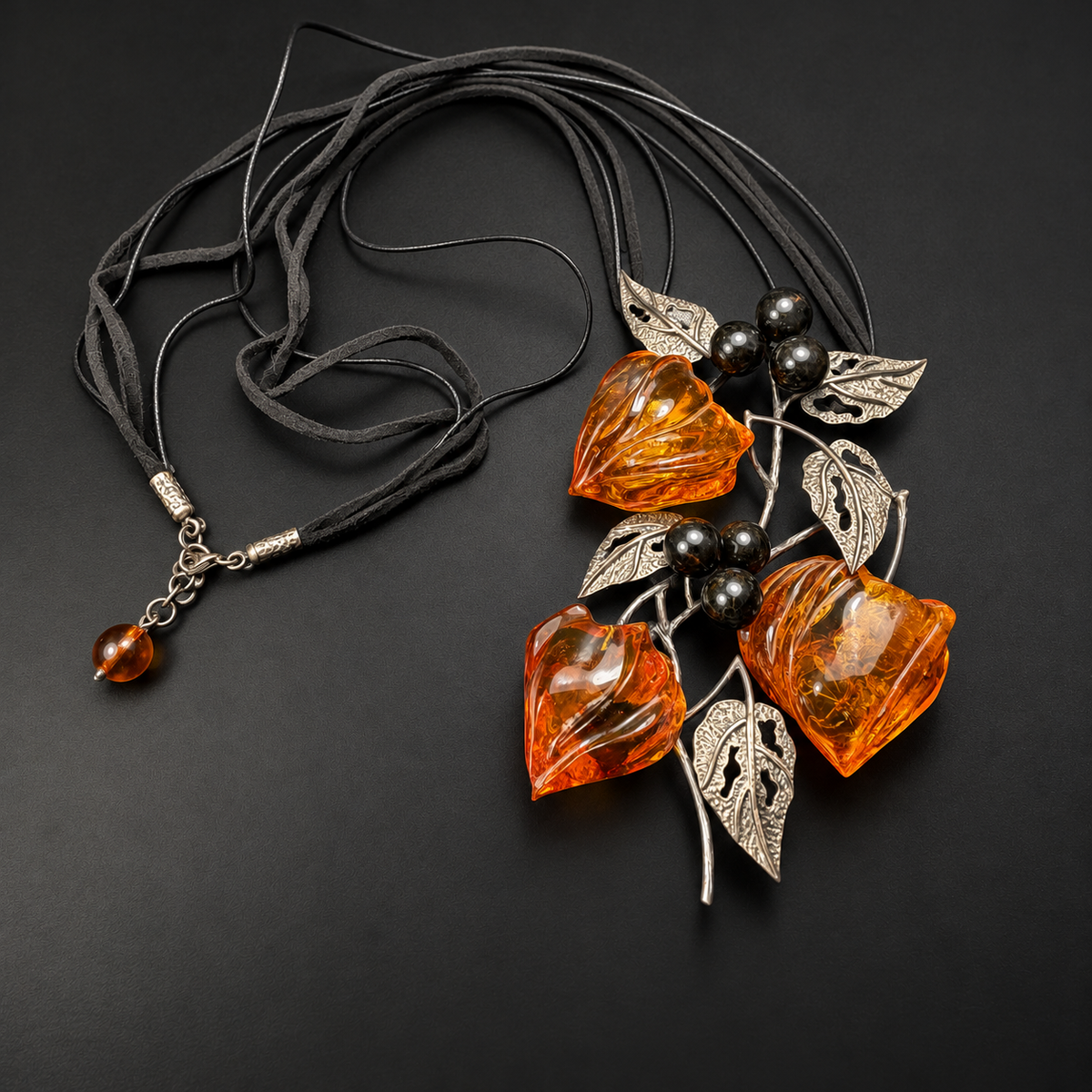 KIZIMA amber physalis necklace with black cords and amber extender drop, studio view 2