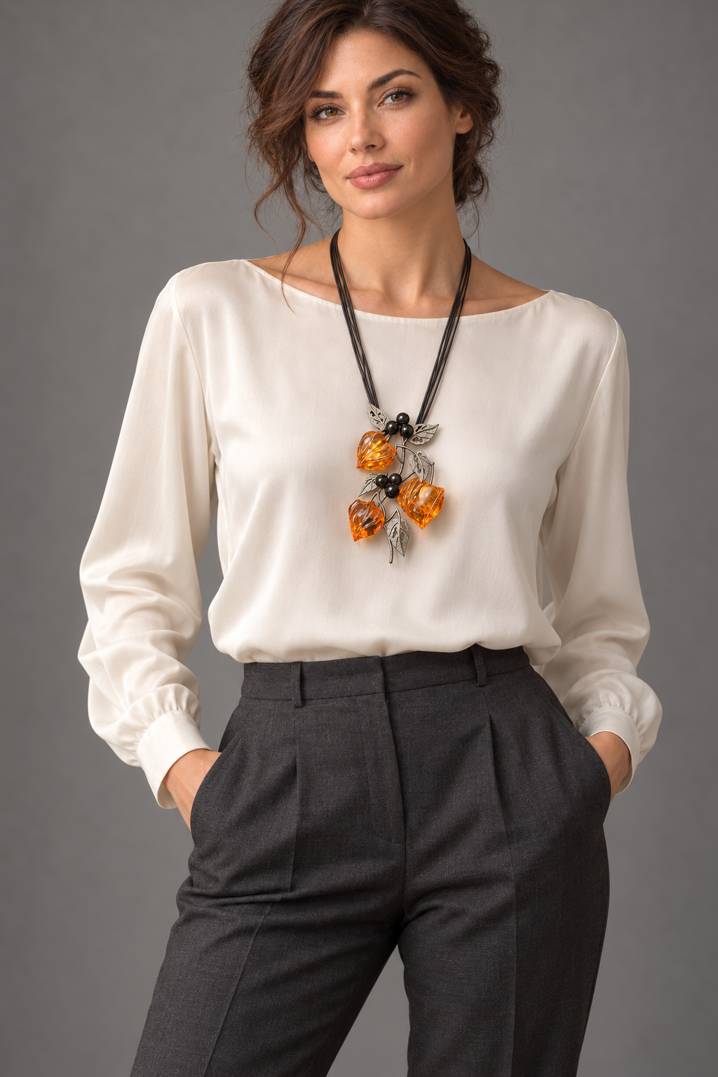AI-styled wearing view of KIZIMA amber physalis necklace on a tall adult woman in an ivory blouse