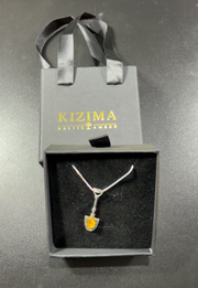 Original KIZIMA money shovel necklace in its gift box with branded gift bag