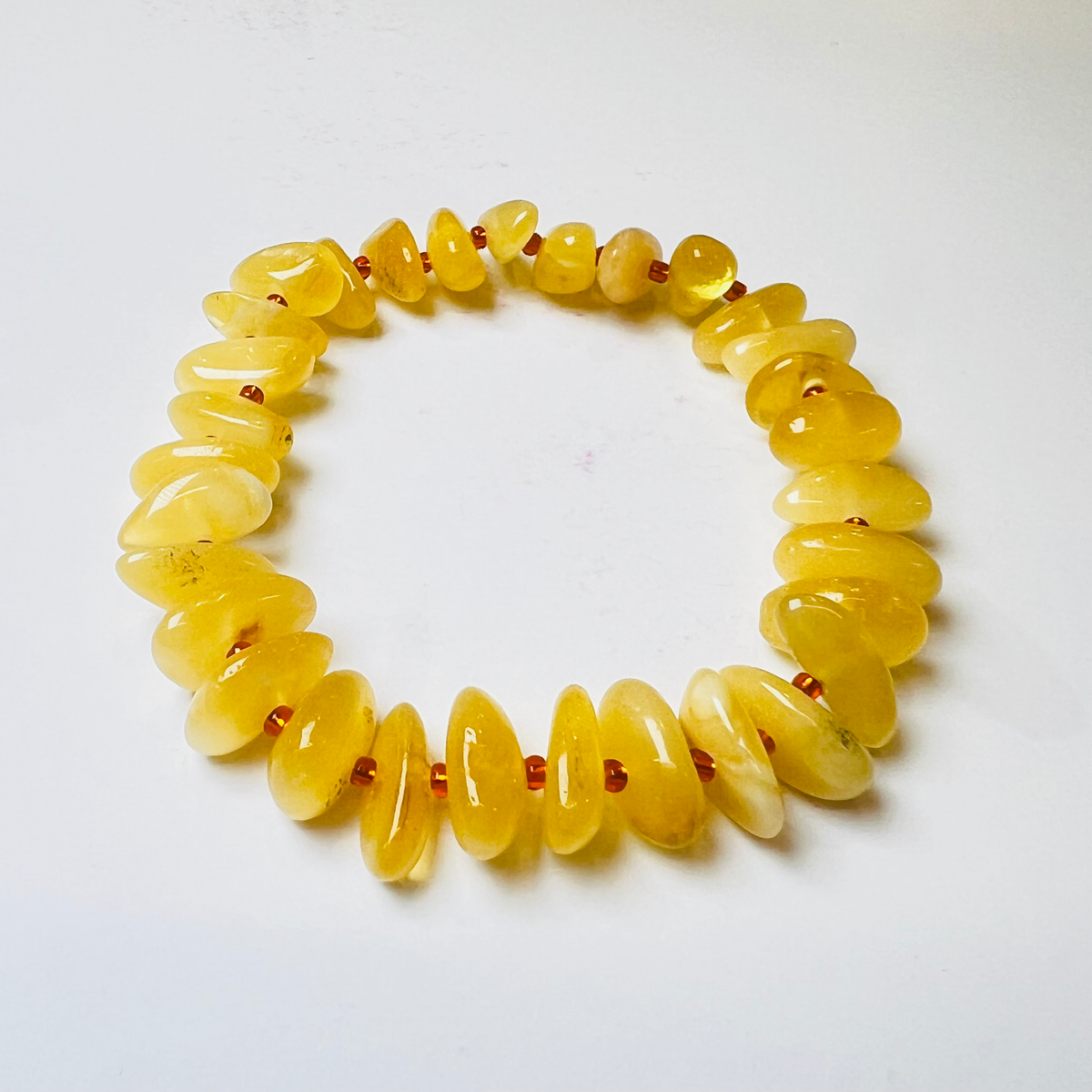 Original camera photograph of KIZIMA 3N0200q11.50 amber jewelry on its real background