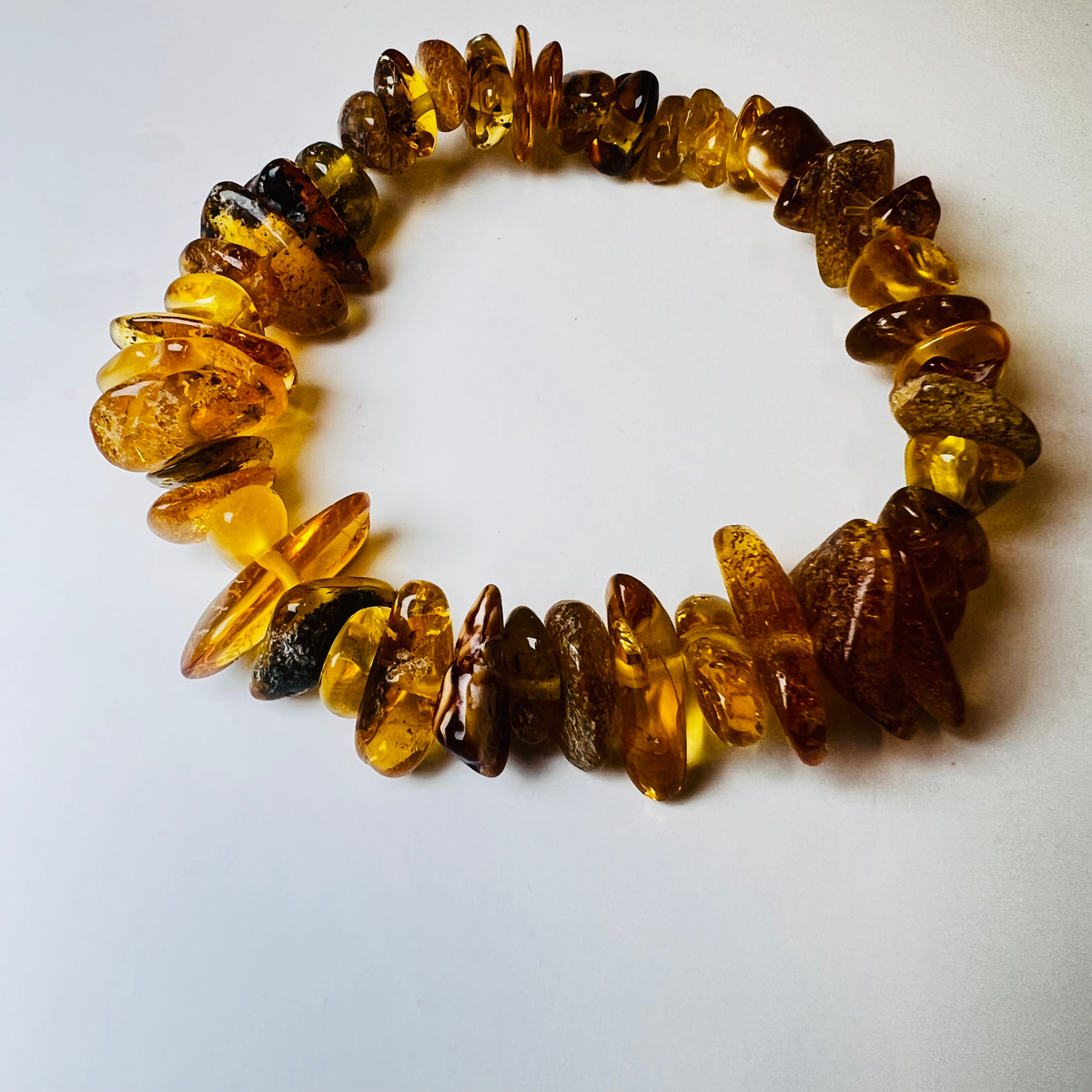 Original camera photograph of KIZIMA 3N0200q14.80 amber jewelry on its real background